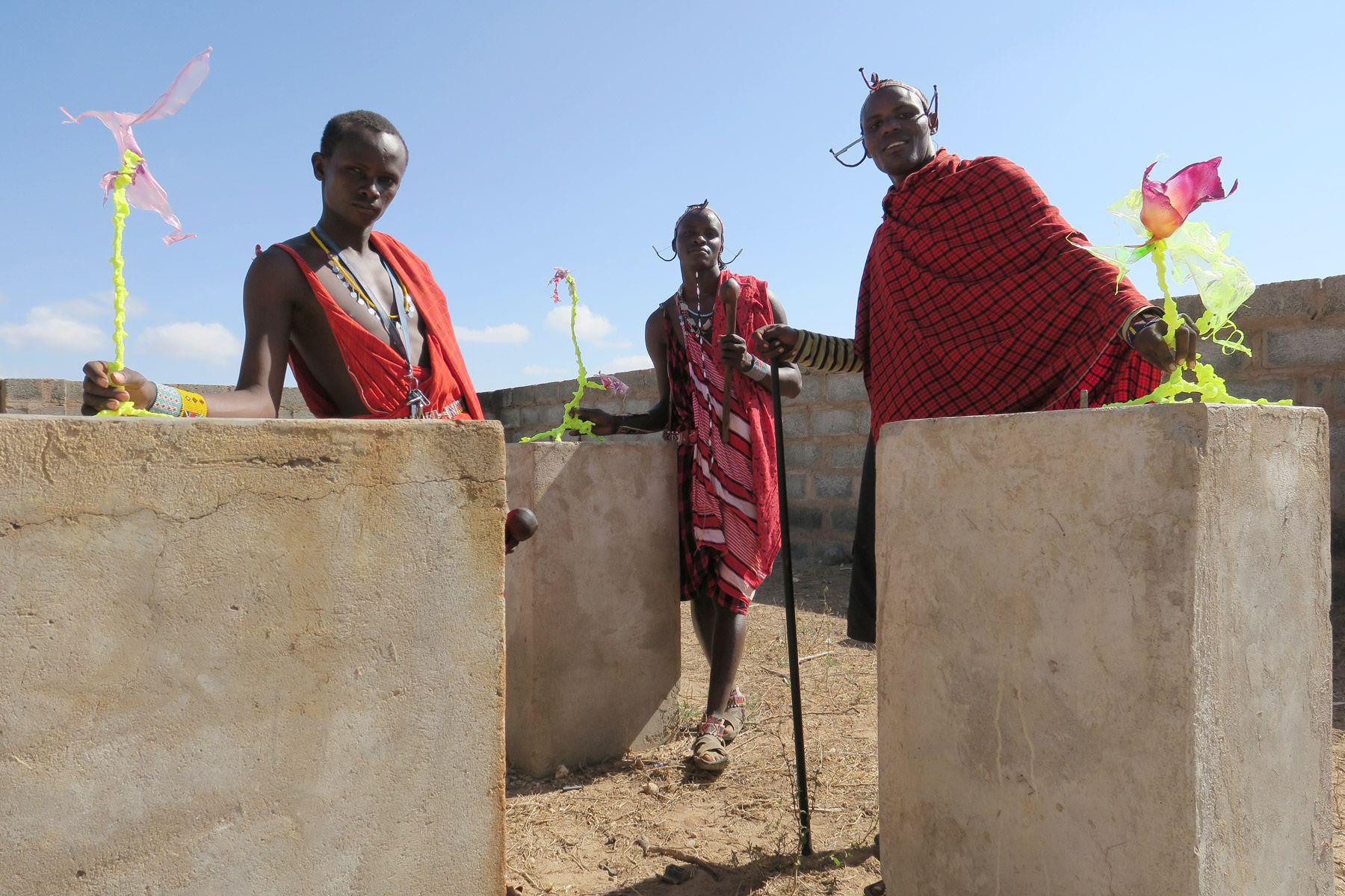 Bioism. Three Maasai men in Kenia