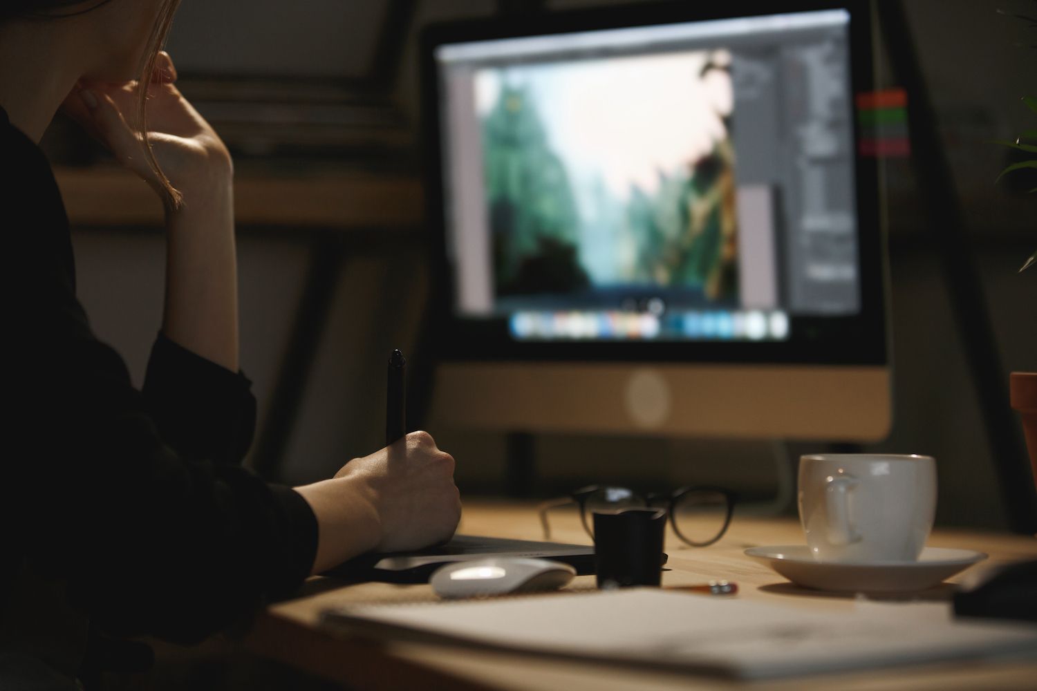 Man and woman looking over a laptop